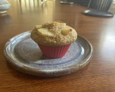 A single muffin on a plate.