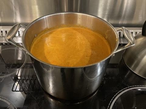 Large pot of prepared soup.