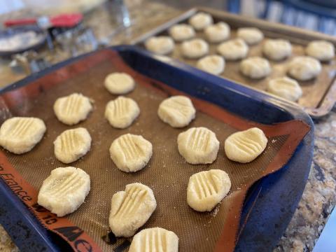 Sugar cookie dough formed into balls and pressed down.