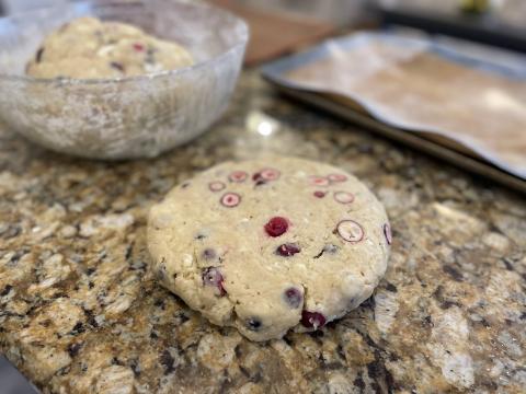 Scone dough flattened into a disk.