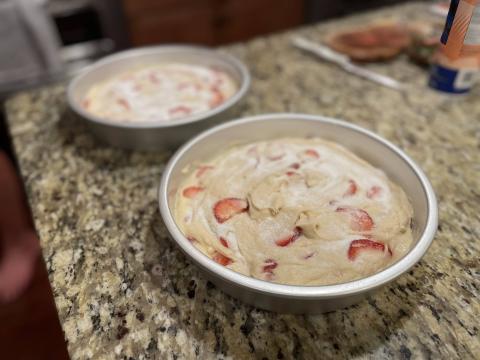 Cake mixture spread in pans.